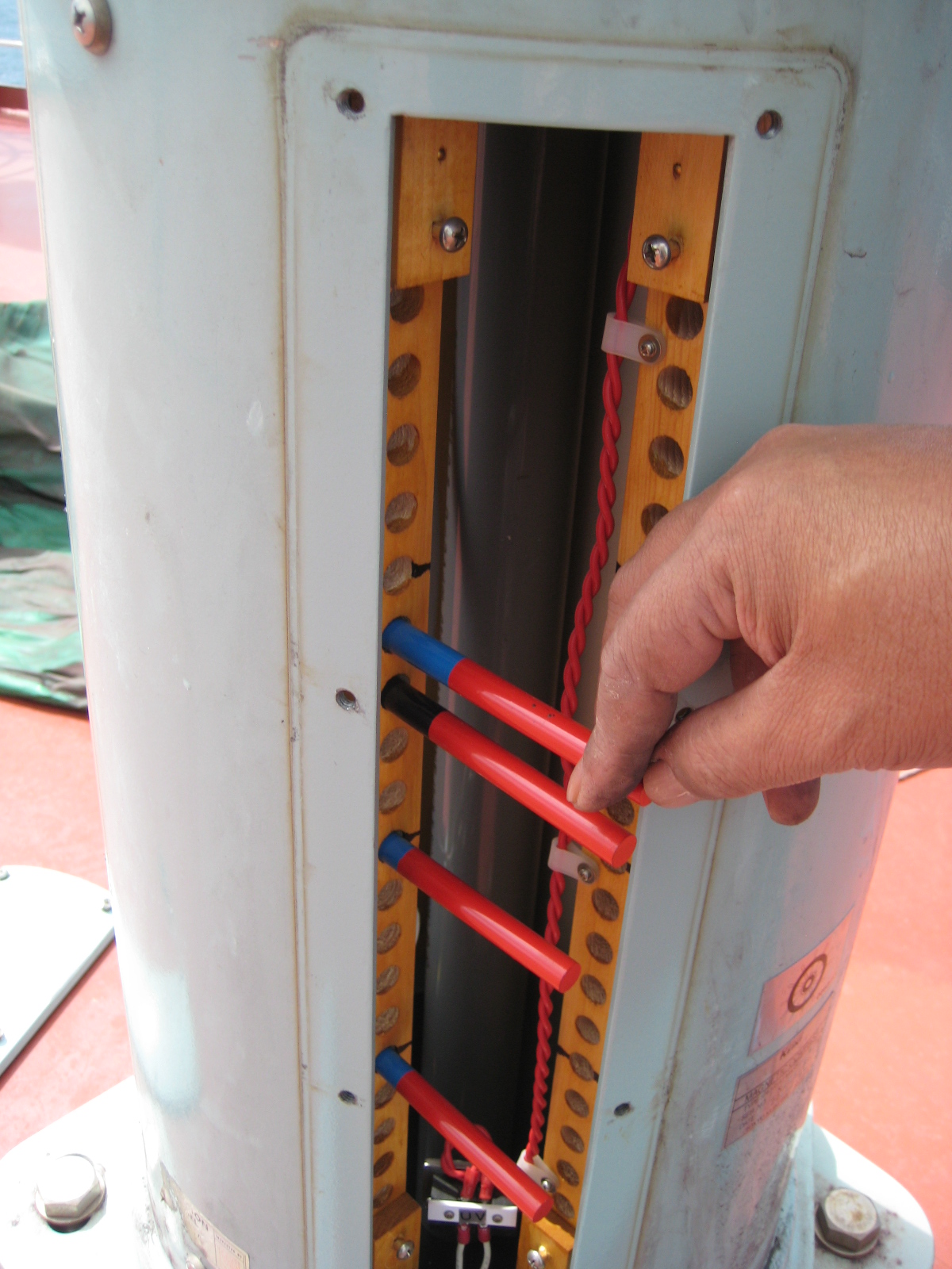 Adjuster placing corrector magnets inside the binnacle